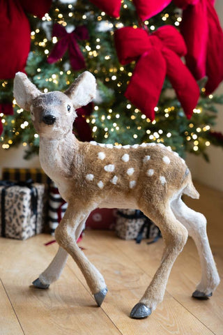 Image of the Baby Deer Christmas Decoration next to a christmas tree