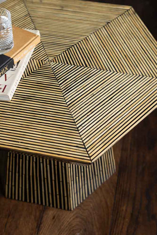 Close up of bamboo inlay hexagon coffee table top on wooden floor
