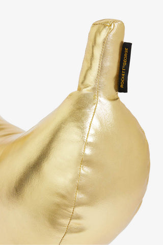 Detail image of the Gold Banana Cushion on a white background.
