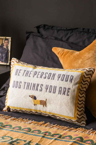 Image of the Be The Person Your Dog Thinks You Are Cushion on a bed setting