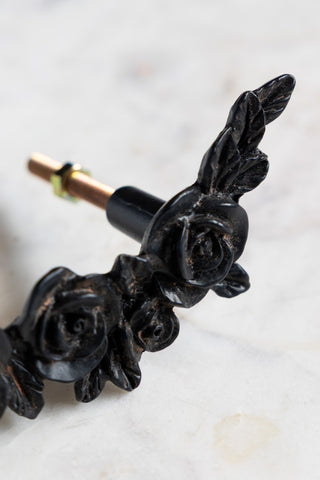 Close-up of the Beautiful Black Rose Cupboard/Drawer Handle on a white surface.