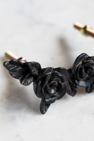Detail shot of the Beautiful Black Rose Cupboard/Drawer Handle on a white surface.
