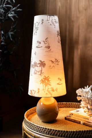Lifestyle image of the Beautiful Desert Island Tapered Table Lamp