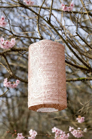 Lifestyle image of the Beautiful Dusk Pink Outdoor Solar Lantern With Stand