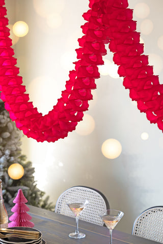 Lifestyle image of the Beautiful Handcrafted Classic Paper Garland in Bright Red