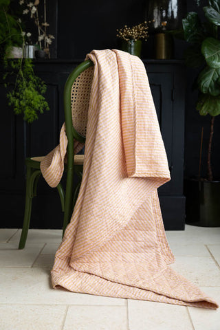 Lifestyle image of the Beautiful Mustard & Pale Pink Stripe Cotton Quilt