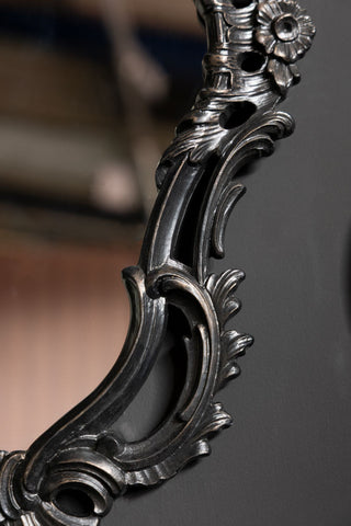 The side of the frame of the Beautiful Ornate Black Wall Mirror. 