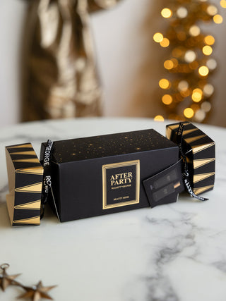 The After Party Hand & Body Beauty Cracker displayed on a marble surface.