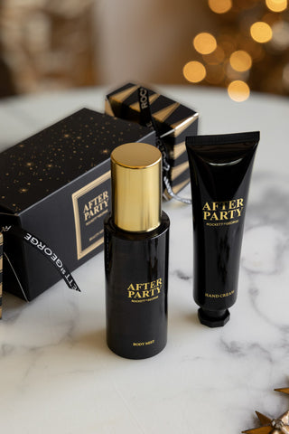 The After Party Hand & Body Beauty Cracker and its contents displayed on a white marble surface.