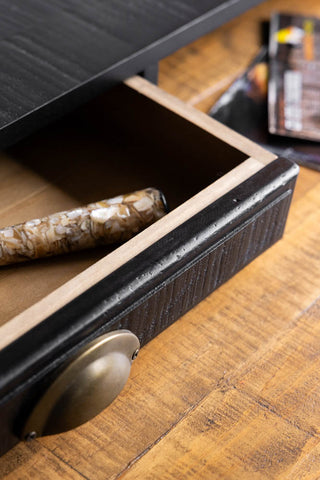 A close up image showing the inside of the drawer of the Black Apothecary Desk With 3 Drawers.