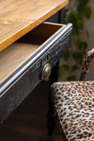 A close up image of the long drawer (shown open) on the Black Apothecary Desk With 3 Drawers.