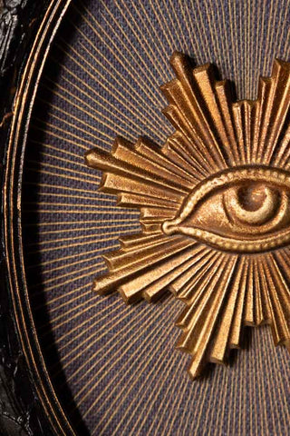 Close-up of the Black Framed Golden Mystic Eye Wall Decor.