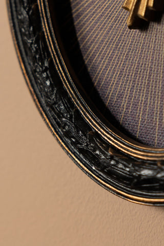 Close-up of the detail on the Black Framed Golden Mystic Eye Wall Decor.