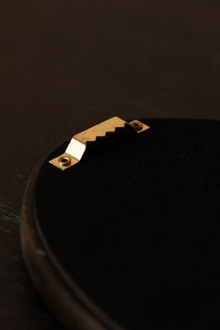 Close-up of the fixture on the reverse side of the Black Framed Golden Mystic Eye Wall Decor.