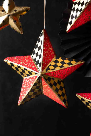 Lifestyle image of the Black, Gold & Red Checkered Star Christmas Decoration