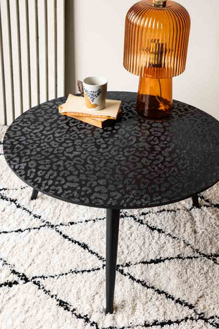Lifestyle image of the black leopard love coffee table. 