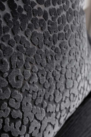 Close-up of the design on the Black Leopard Velvet Cushion with Fringe Trim.