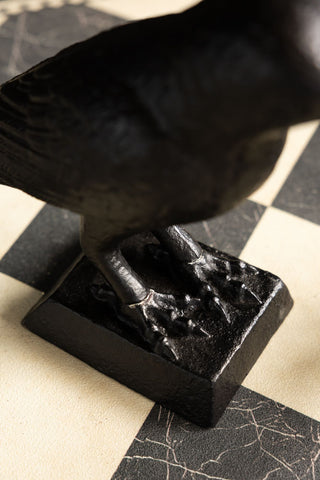 Close-up of the base of the Black Raven Cast Iron Doorstop.