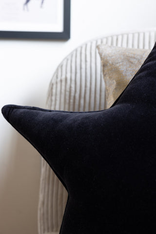 Close-up image of the Black Star Velvet Cushion