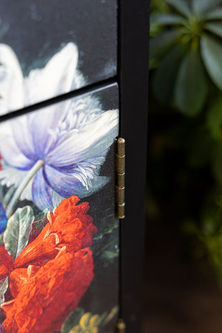 Close up showing the detail of the flower pattern on the Black Still Life Floral Bedside Table. 