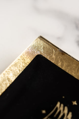 Close-up image of the Black & Gold Milagro Heart Trinket Tray