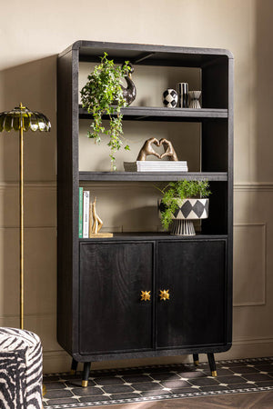 image of Black & Gold Ringo Shelving Unit shown against a panelled wall with monochrome and gold accessories on the open shelves. 