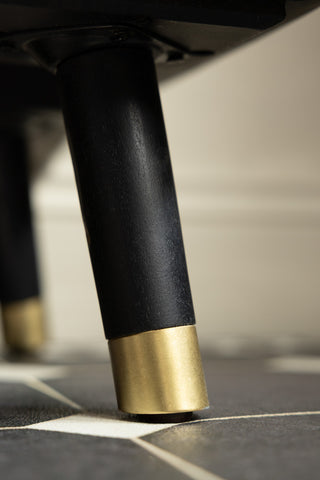 Gold tipped legs on the Black & Gold Ringo Shelving Unit.