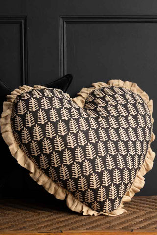 Lifestyle image of the Black & Natural Leaf Ruffle Heart Cushion