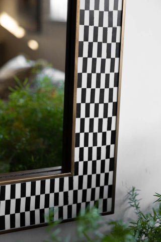 Close-up image of the Black & White Checkered Mirror