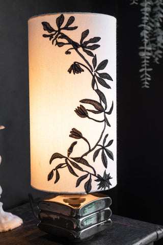 Lifestyle image of the Black & White Floral Silhouette Table Lamp