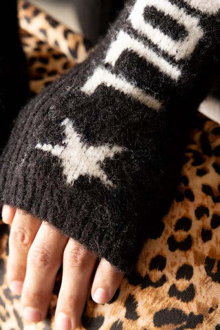 Close-up of the Black & White Rock 'N' Roll Handwarmers on a model's hands.
