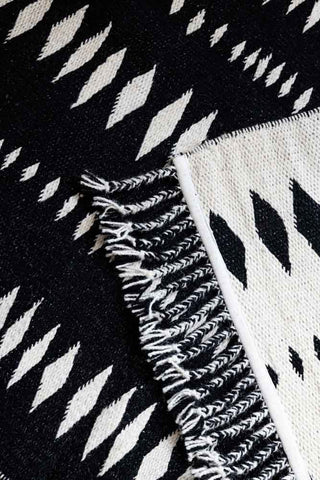 Close-up image of the Black & Off-White Geometric Flatweave Rug - Available in 5 Sizes