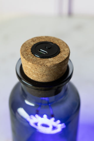 Close-up of the top of the Blue Eye Neon Bottle Light.