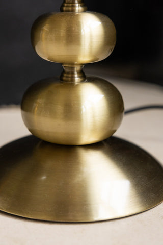 Close-up of the base of the Solar Goddess Bobbin Floor Lamp.