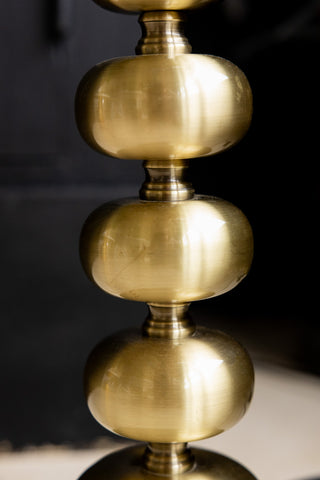 Close-up of the design of the Solar Goddess Bobbin Floor Lamp.