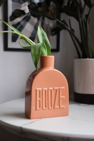Lifestyle image of the Orange Booze Vase