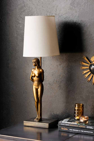 Lifestyle image of the Brass Lady Table Lamp