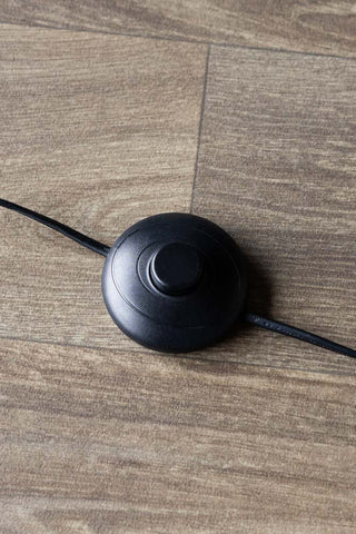 Close-up of the rocker switch on the Brass Slim Floor Lamp.
