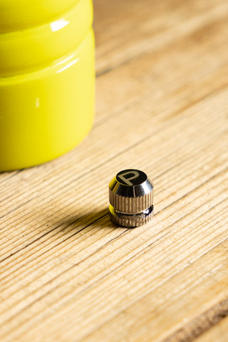 Close-up of one of the toppers of the Neon Yellow Salt/Pepper Mill.