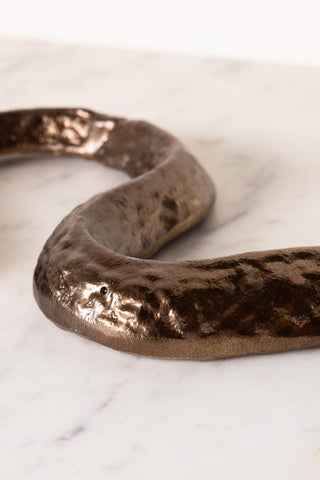 The metal texture on the body of the Bronze Cobra Snake Ornament. 