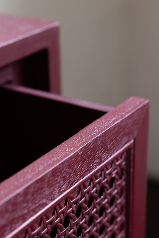 Close-up of the drawer on the Burgundy Rattan Bedside Table.