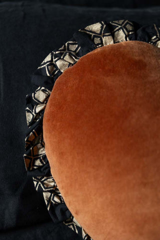 Close-up image of the Burnt Orange Velvet Ruffle Heart Cushion