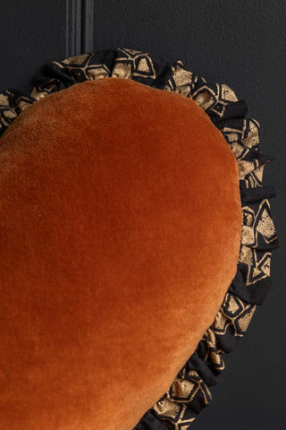 Detail image of the Burnt Orange Velvet Ruffle Heart Cushion
