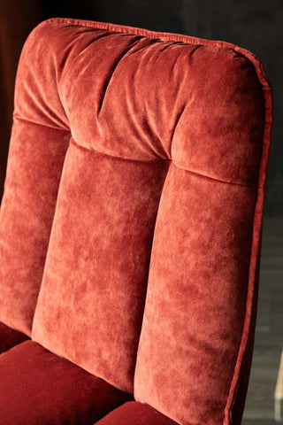 Close-up of the back of the Burnt Orange Velvet Swivel Dining Chair.