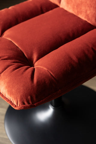 Close-up of the seat of the Burnt Orange Velvet Swivel Dining Chair.