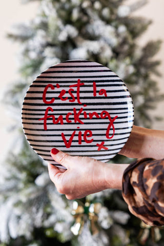 Lifestyle image of the C'est La Fucking Vie Decorative Wall Plate