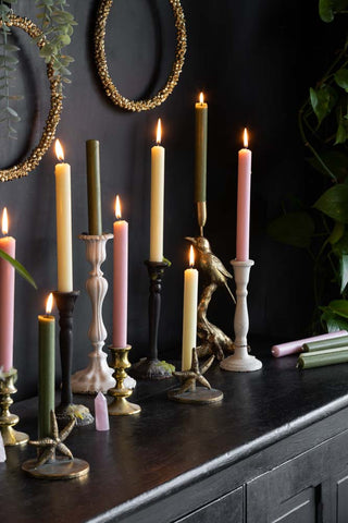 Image of beautiful mustard, pink, green and gold candlestick holders.
