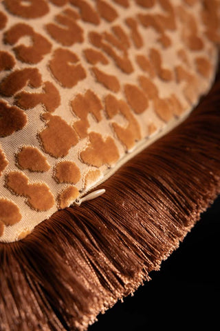 Close-up of the zip on the Ochre Leopard Velvet Cushion with Fringe Trim.