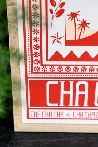 Styled detail image of the Cha Cha A2 Art Print in Red in a natural frame