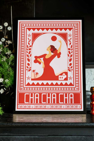 Styled image of the Cha Cha A2 Art Print in Red in a black frame on a dark background